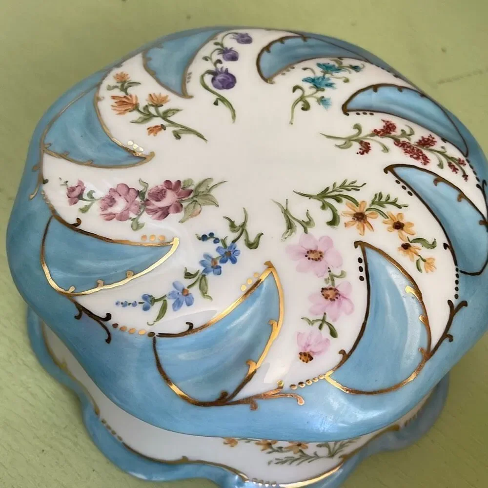 Vintage hand painted porcelain trinket box  by Jeanette Wriedt .